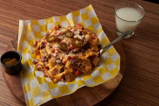 loaded nachos with cheese jalapeños sour cream